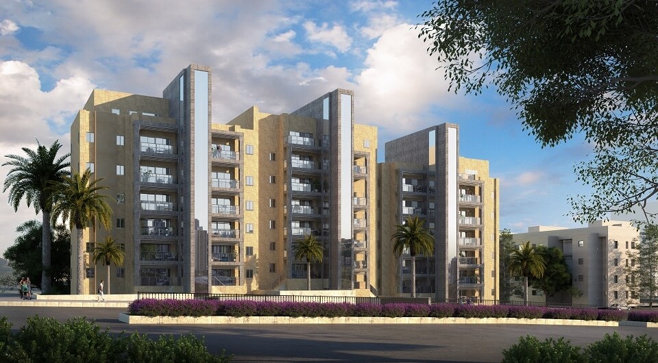 בניינים, כביש ועצים על רקע שמיים מעוננים